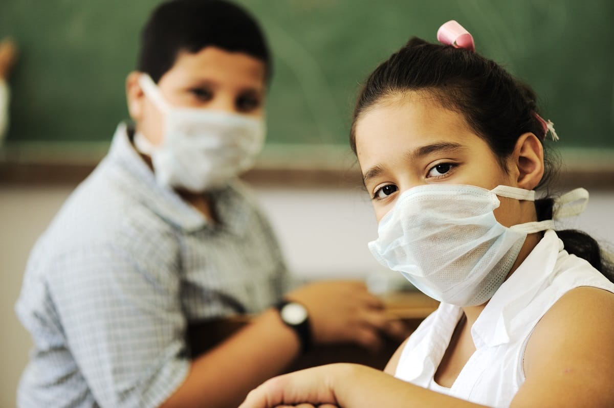 Children masked in school.
