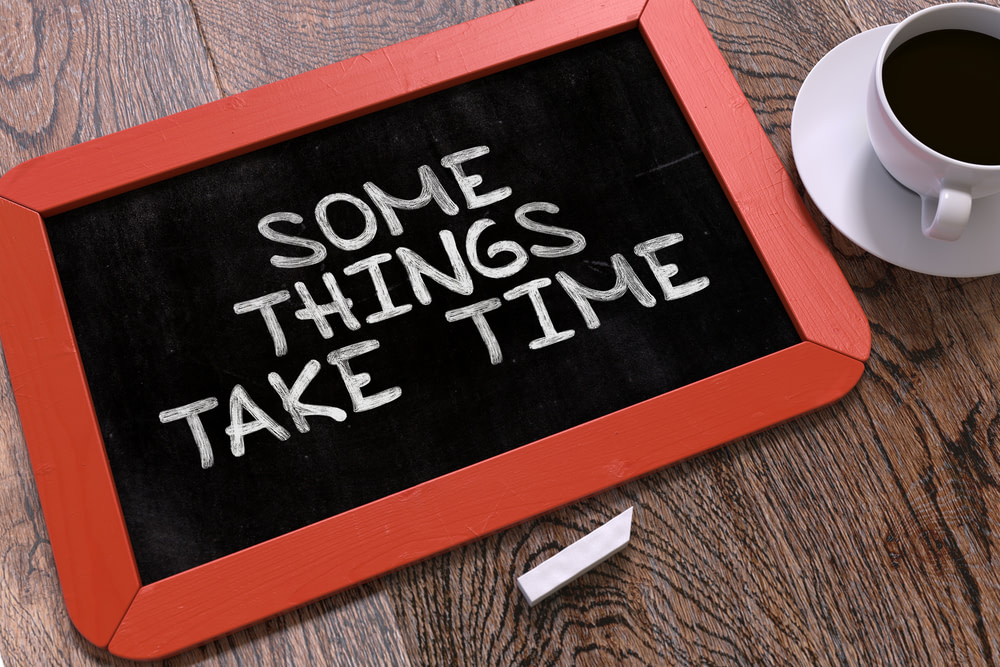 Some Things Take Time Handwritten by White Chalk on a Blackboard Some Things Take Time